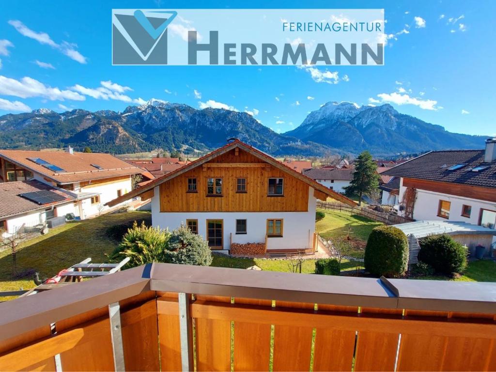 a house with a view of the mountains at Ferienwohnung Fernsicht in Schwangau