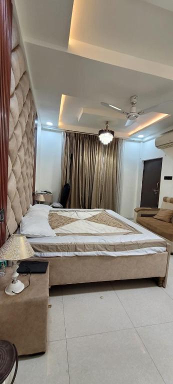 a large bedroom with a large bed in it at Cozzy in Nagpur