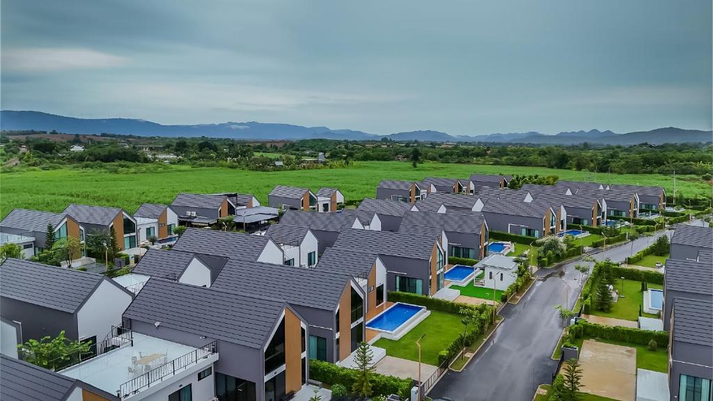 an aerial view of a row of houses in a suburb at Gaia Pool Villa Khao Yai in Ban Bung Toei