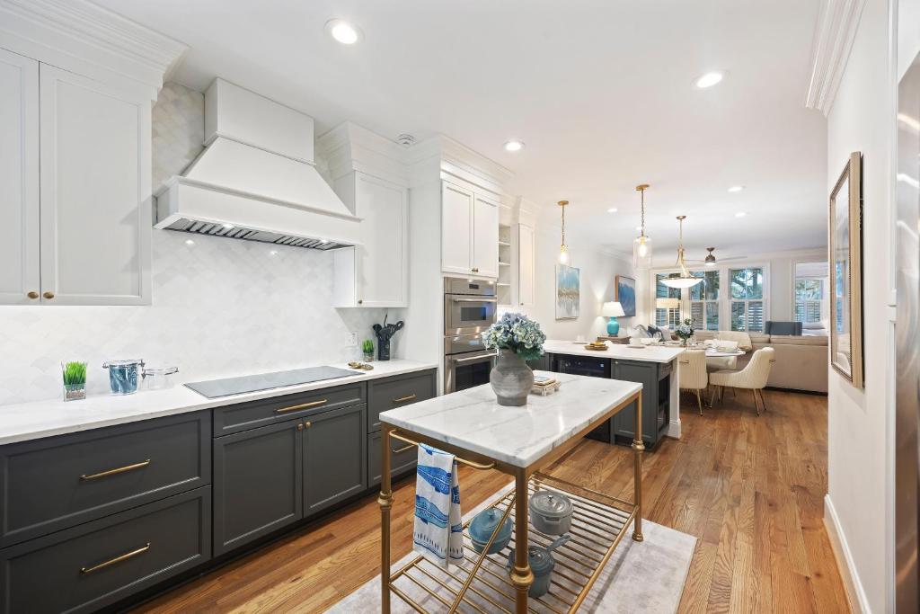 a kitchen with black cabinets and a white counter top at 3026 Fairway One in Seabrook Island