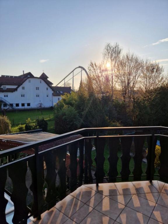 a bridge with a view of a roller coaster at Huus 17 in Rust