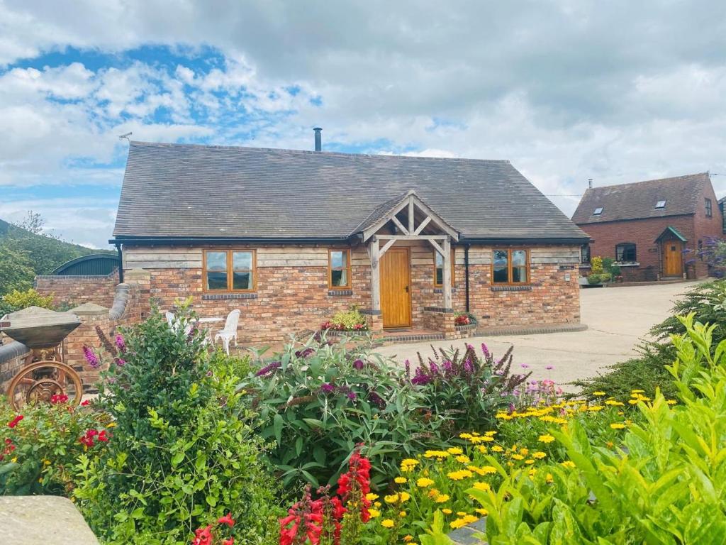 a brick house with a garden in front of it at 2 Bed in Shrewsbury oc-77771 in Leighton
