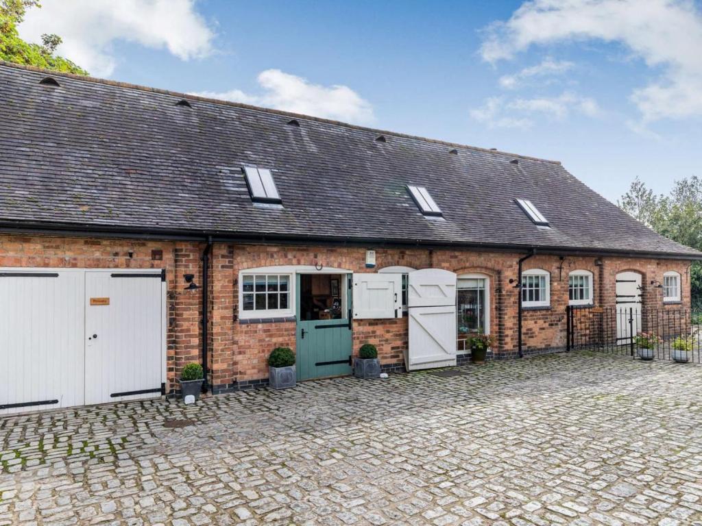 an old brick building with two garages at 2 Bed in Ashbourne oc-89339 in Edwalton