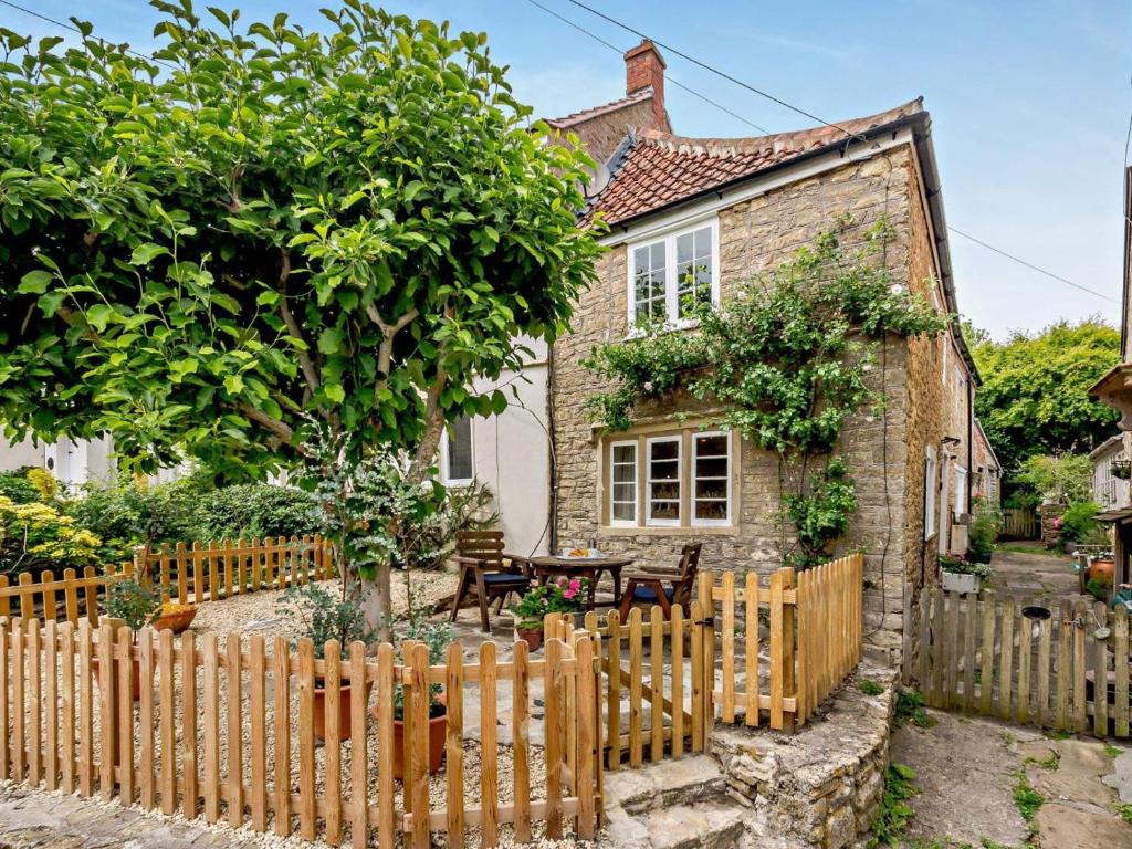 a wooden fence in front of a house at 1 Bed in Frome oc-91715 in Woolverton