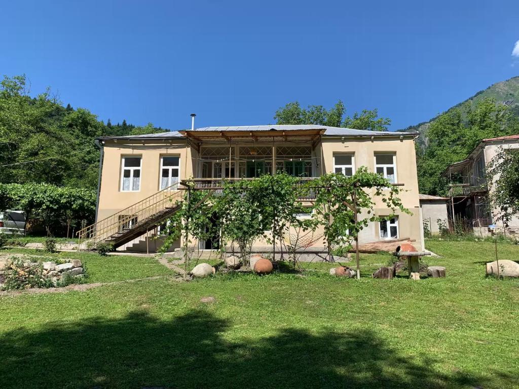 a house with a staircase in front of it at Authentic house with a huge garden in Utsera
