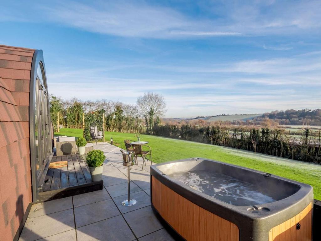 a hot tub on the patio of a house at 1 Bed in Alfreton oc-90518 in South Wingfield