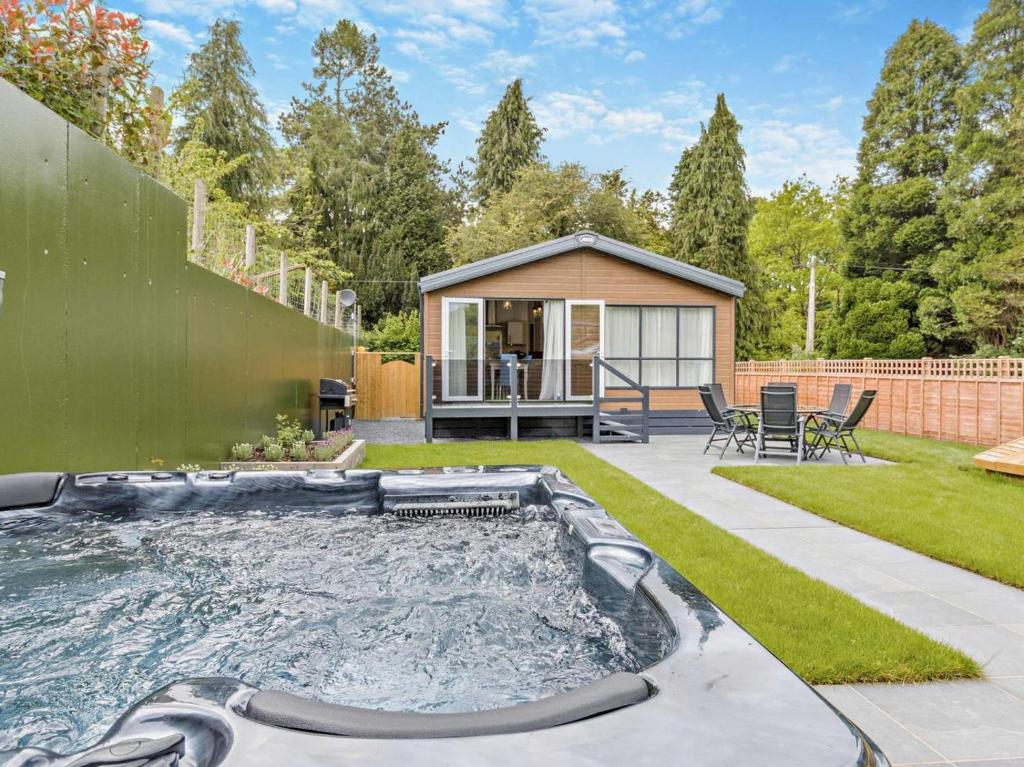 a backyard with a swimming pool and a house at 3 Bed in Shrewsbury oc-94112 in Bromlow