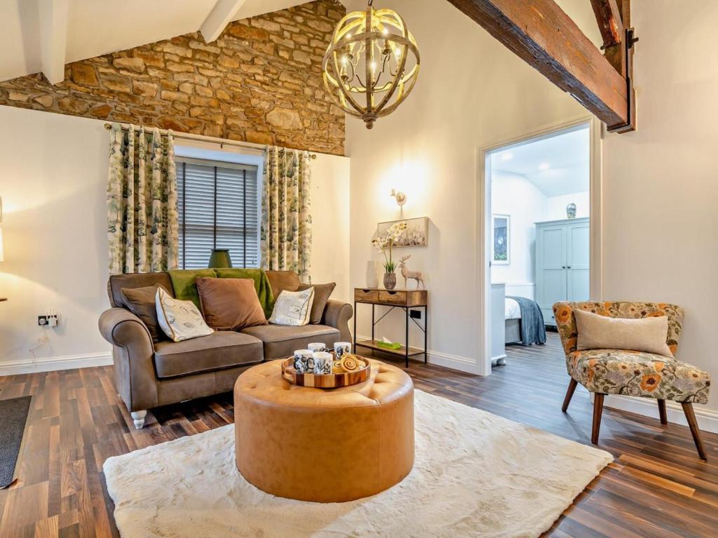 a living room with a couch and a table at 2 Bed in High Peak oc-94058 in New Mills