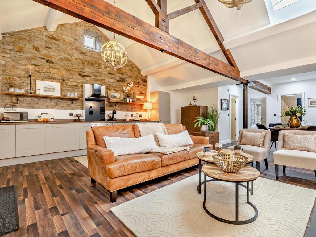 a living room with a couch and a table at 2 Bed in High Peak oc-94059 in New Mills