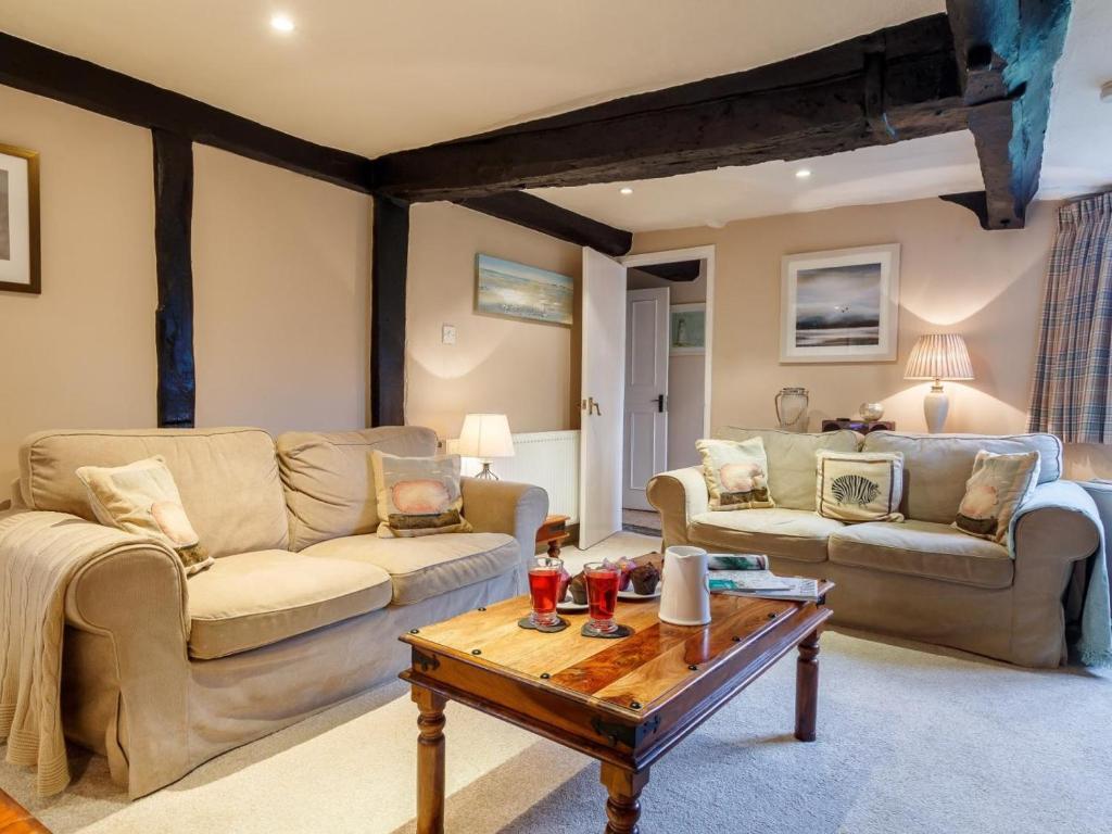 a living room with two couches and a coffee table at 2 Bed in Evesham oc-49245 in Cleeve Prior