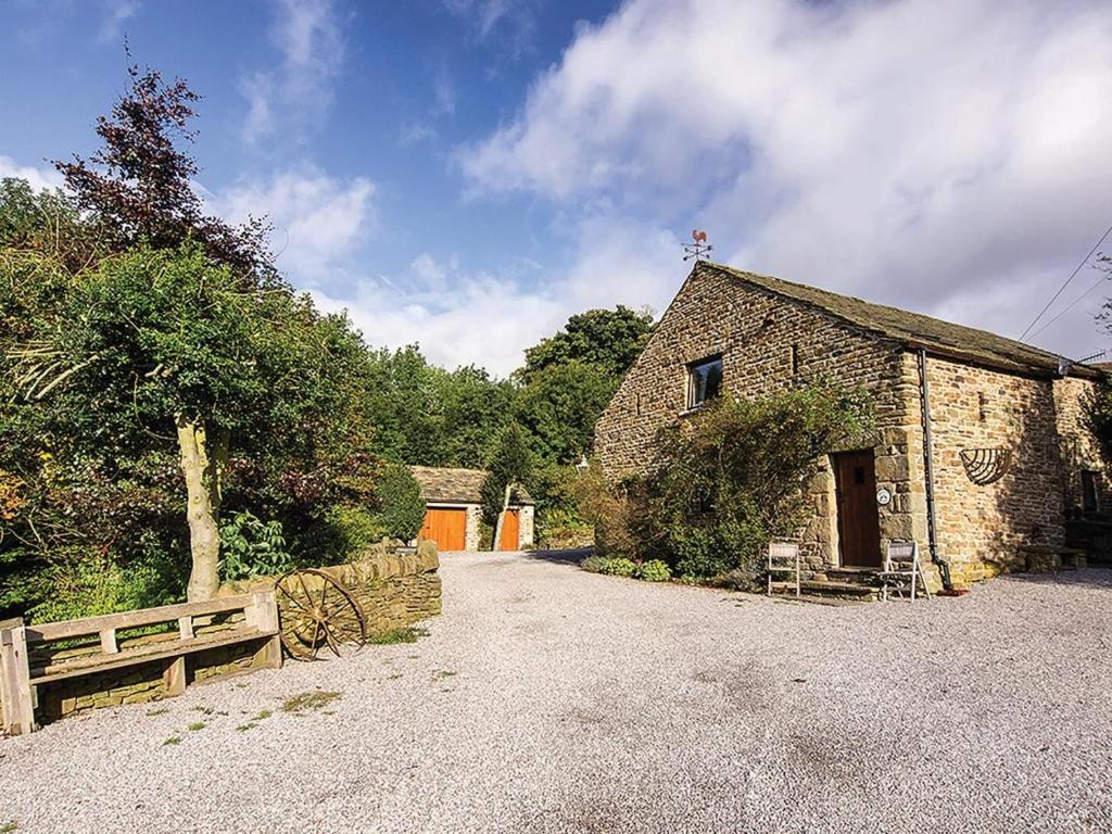 an old stone building with a bench next to it at 2 Bed in Hope Valley oc-pk431 in Aston