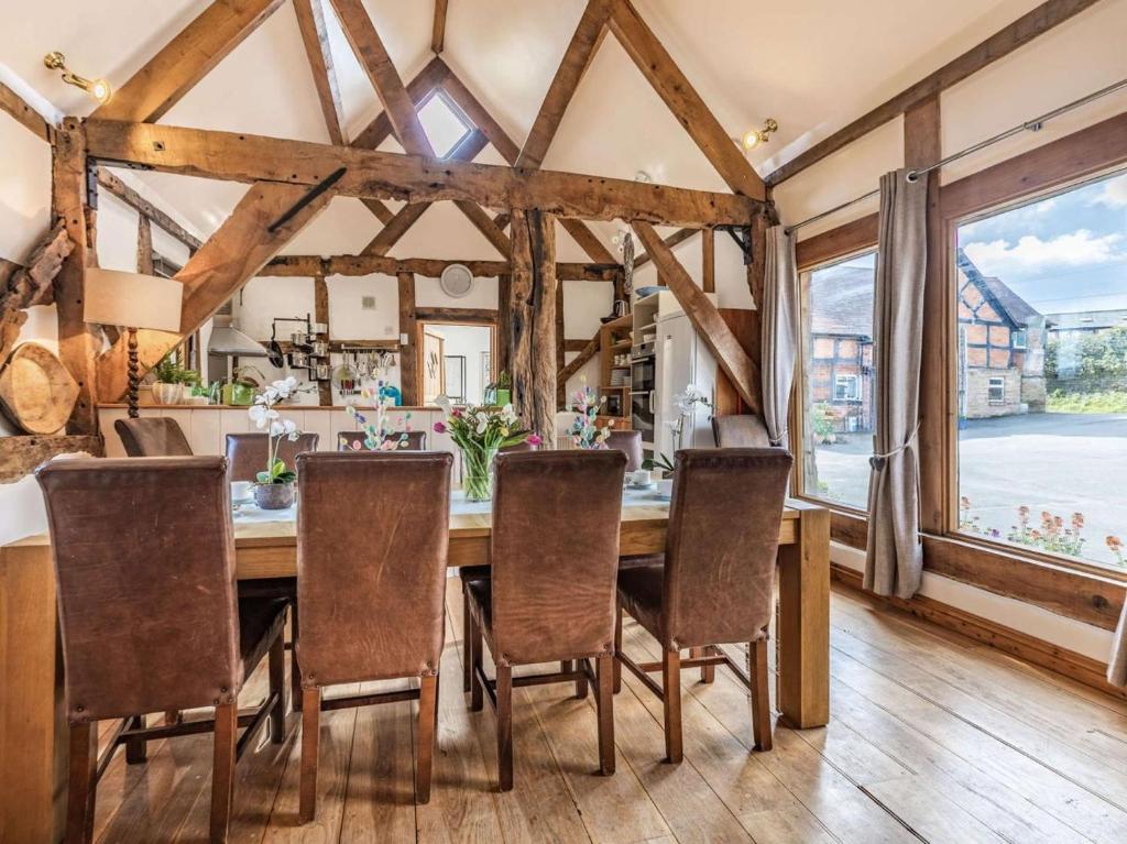 a dining room with a wooden table and chairs at 4 Bed in Ludlow oc-chl22 in Orleton