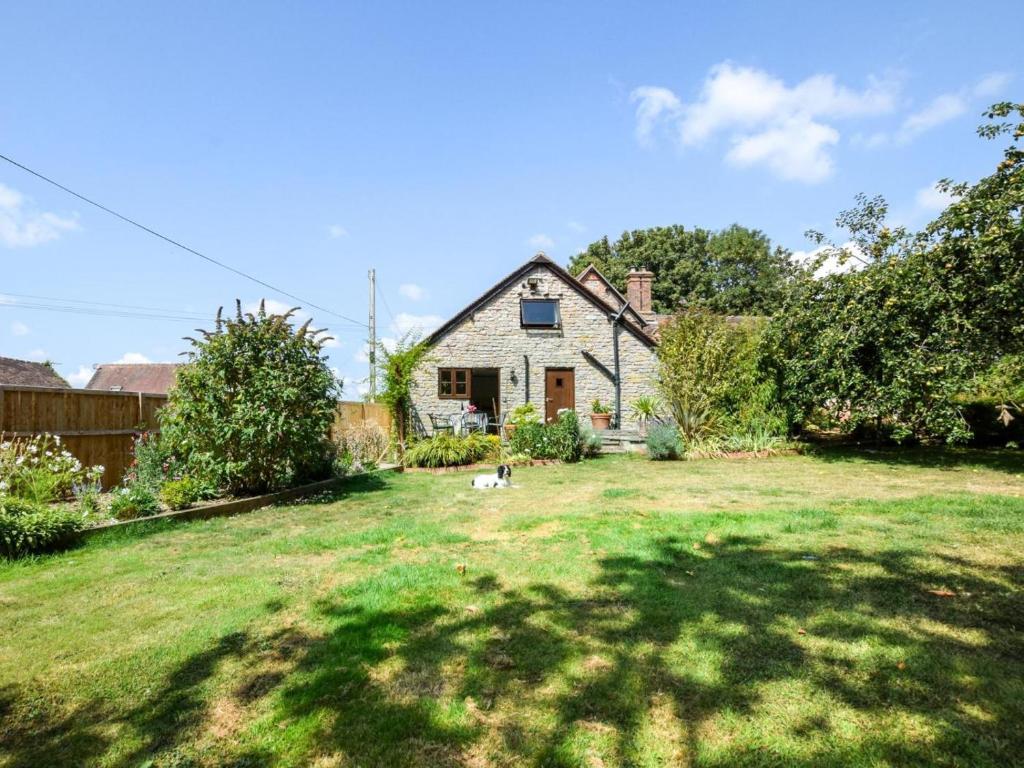 a house with a dog in a yard at 2 Bed in Kidderminster oc-90642 in Stottesden