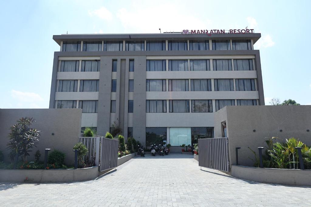 a building with a fence in front of it at Manratan Resort in Narsinghgarh