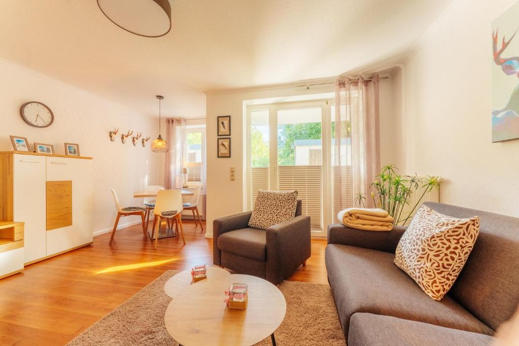 a living room with a couch and a table at Klippenblick in Schierke
