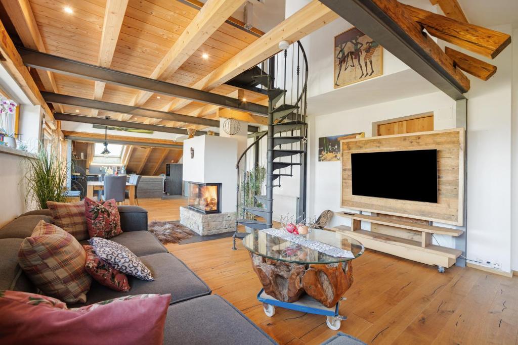 a living room with a fireplace and a tv at I'd Love To Be Home in Bidingen