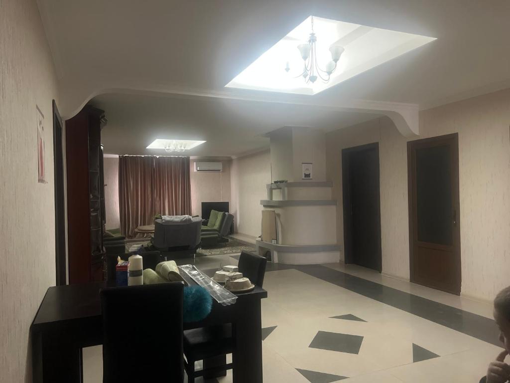 a living room with a couch and a ceiling at Marikuna in Gori