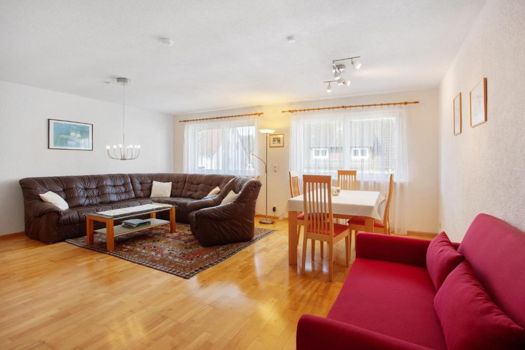 a living room with a couch and a table at Ferienwohnung Rehm in Bad Säckingen