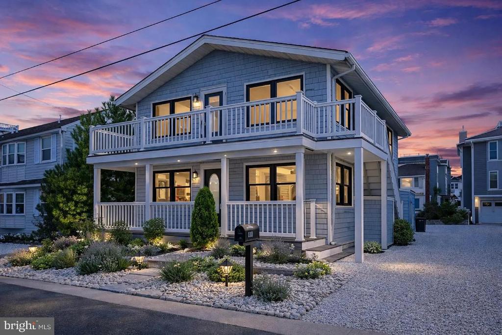 a house with a balcony on top of it at Mermaid Lane #2 in Brighton Beach
