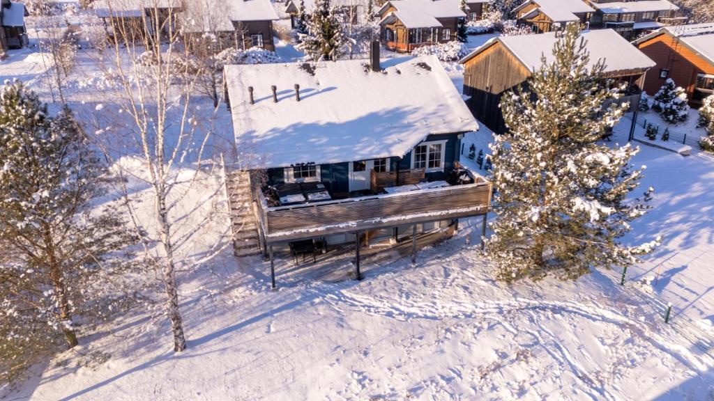 an aerial view of a house in the snow at Kelkkakoivu in Jämsä