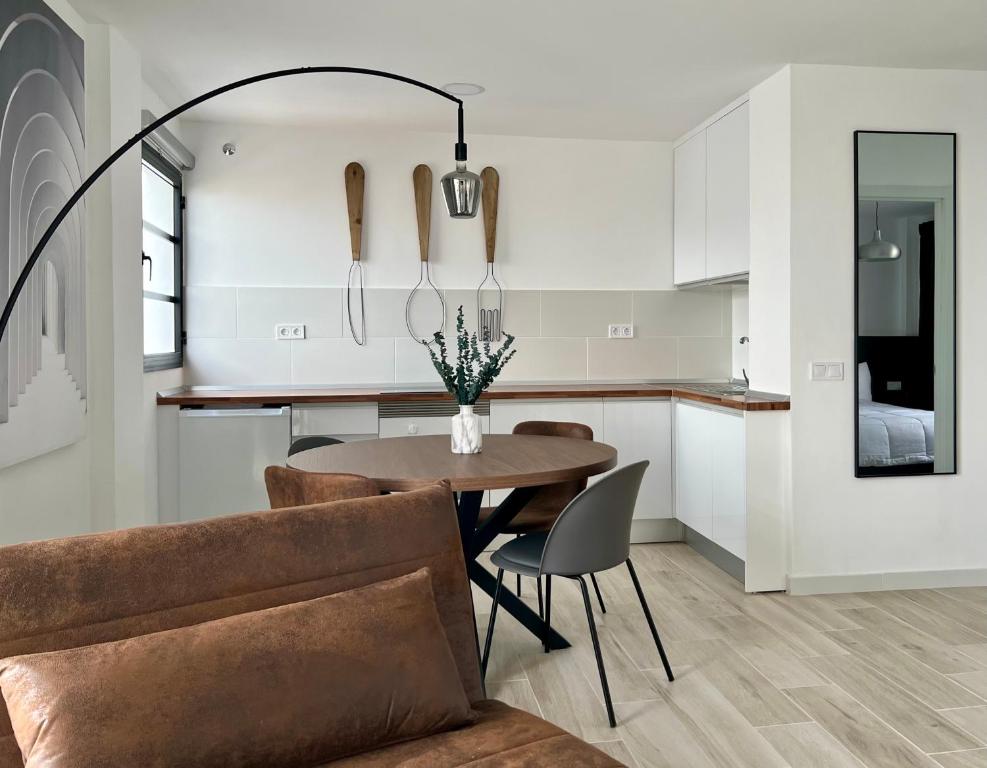 a kitchen and dining room with a table and chairs at Canaryislandshost l Balcón del Mar in Puerto del Carmen