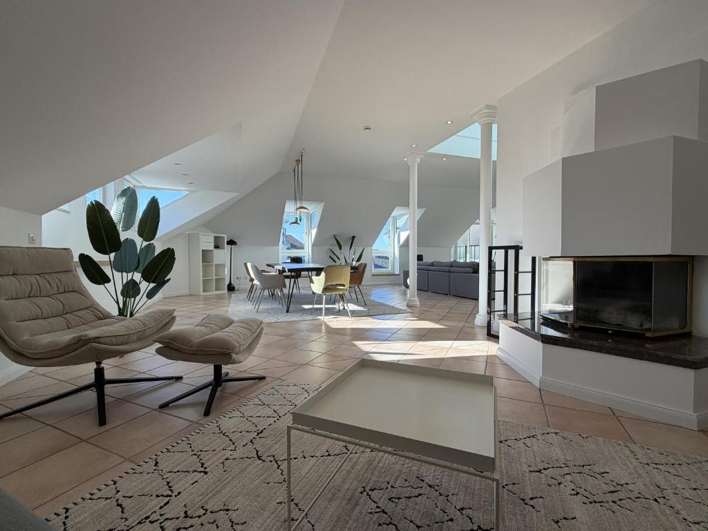a living room with a fireplace and a table at Wertschätzer III - Paulinenstr in Detmold