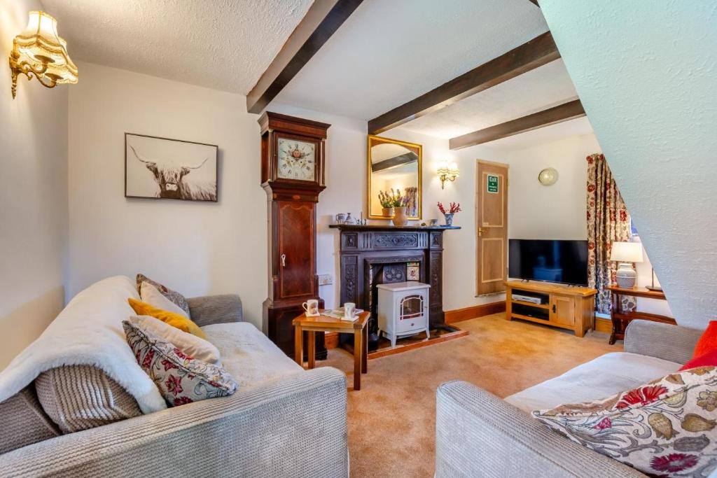 a living room with two couches and a fireplace at 2 Bed in Clitheroe oc-la156 in Harrop Fold