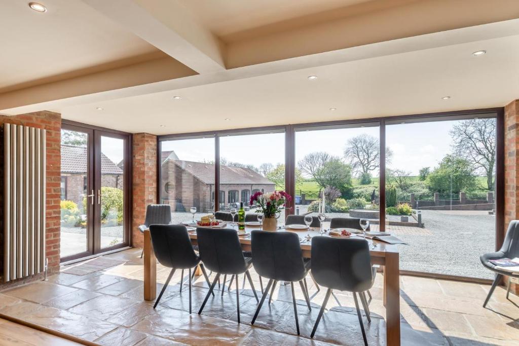 a dining room with a table and chairs at 4 Bed in Thwing oc-t29013 in Thwing