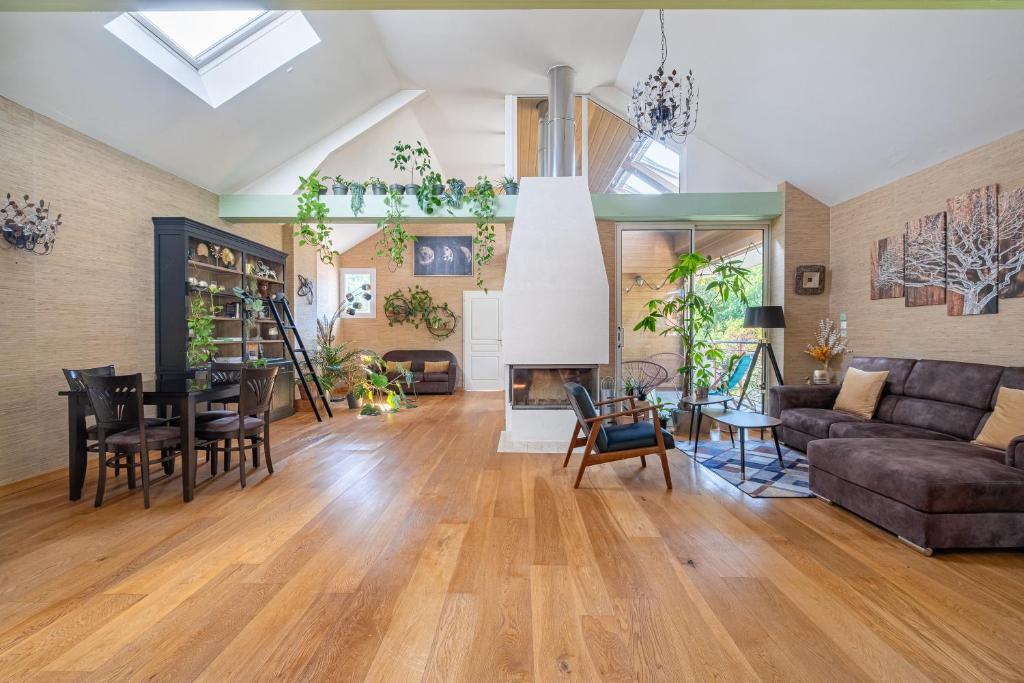 a living room with a couch and a table at Cosy Loft in Nantes in Nantes