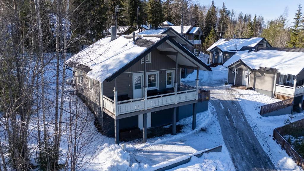 an aerial view of a house in the snow at Villa Magnolia 2 Himos in Jämsä