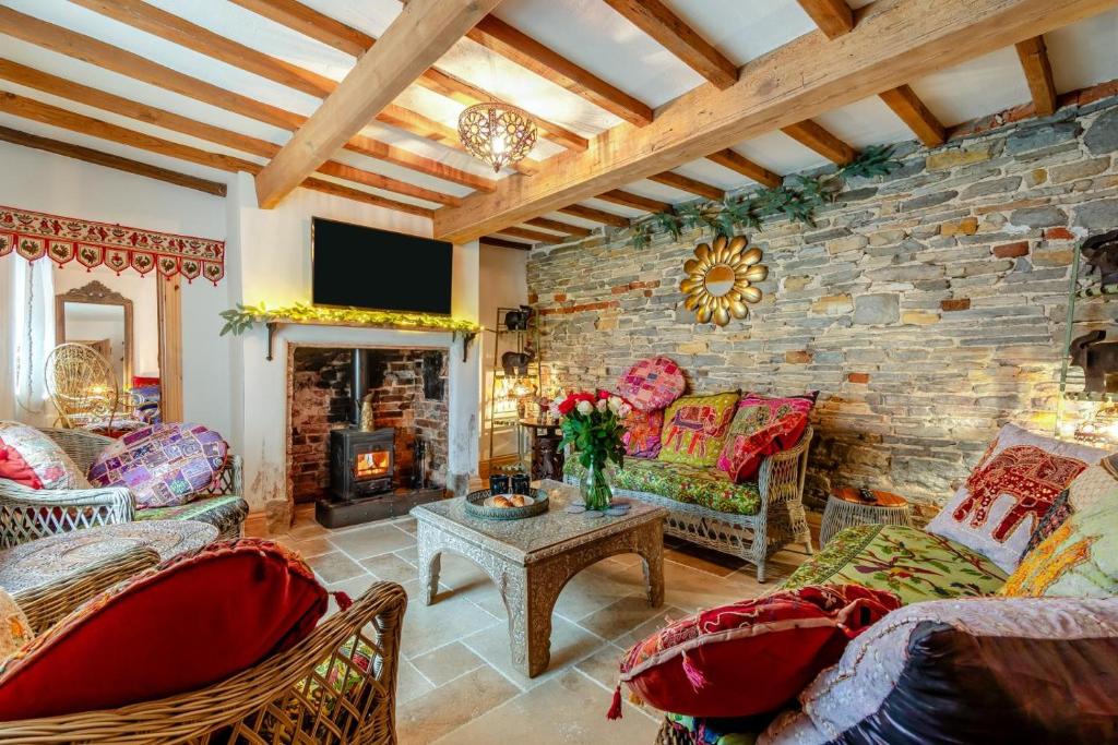 a living room with a stone wall at 4 Bed in Long Bennington oc-p29872 in Long Bennington