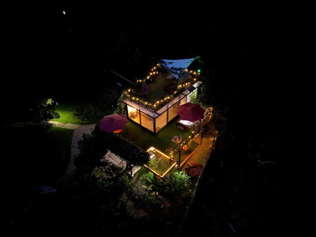 an overhead view of a house with lights on it at Oasis Glamping Tena Cun Vía La Mesa Anapoima in Tena