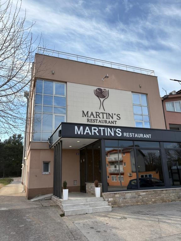 a martini restaurant sign on the side of a building at Hotel Martin in Međugorje