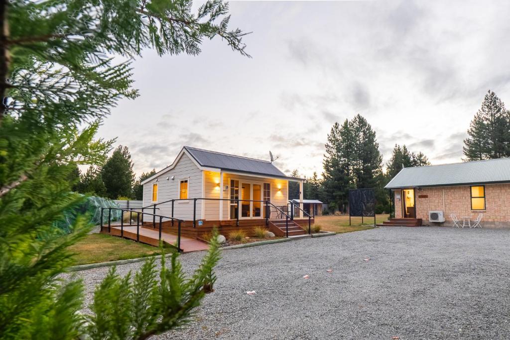 a house with a driveway in front of it at The Dales in Twizel
