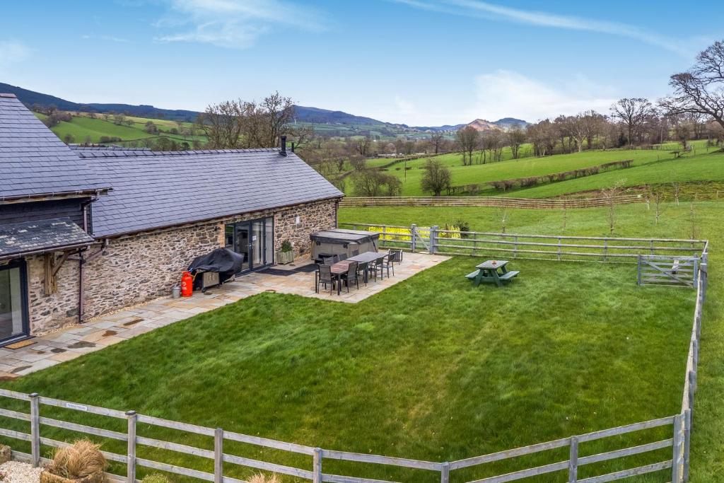 an aerial view of a house with a yard at Y Beudy The Dairy in Oswestry