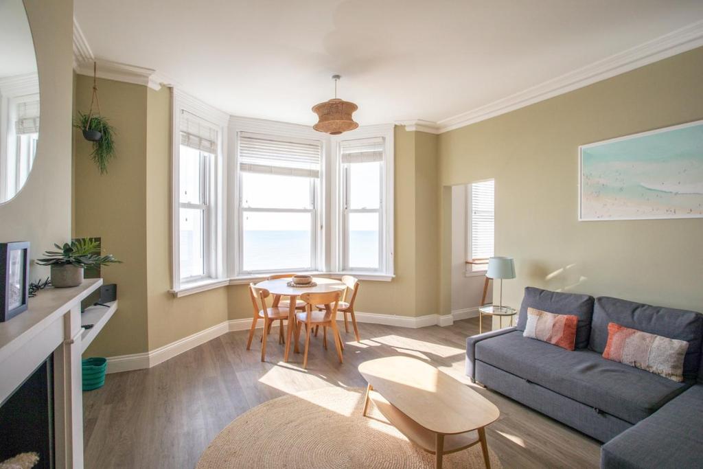 a living room with a couch and a table at Seaview in Worthing