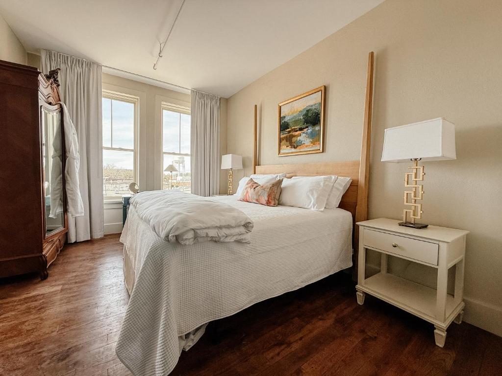 a bedroom with a large bed and a window at The St Nicholas Hotel in Albany