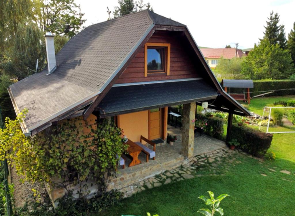 a small house with a gambrel roof at Country House Liptov in Svätý Kríž