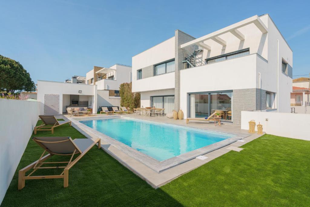 an image of a house with a swimming pool at Chill Villa - Signature by Paradise Portugal in Mariquiteira