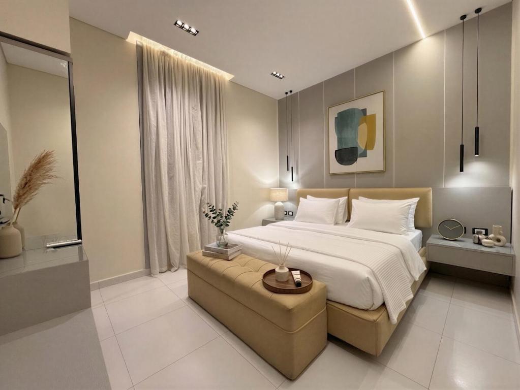 a bedroom with a large bed and a couch at The Grand Elite Cairo Hotel in Cairo