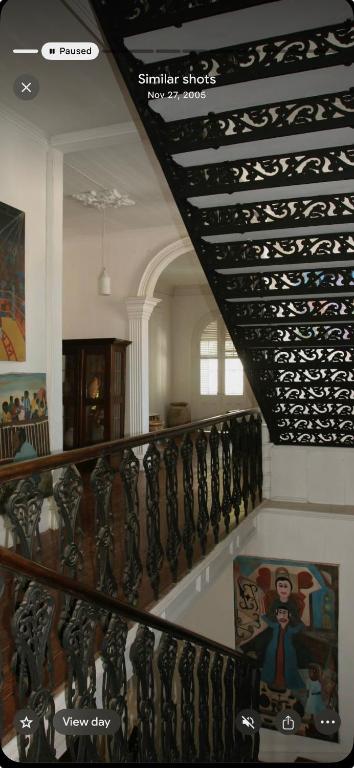 a staircase with a bunch of wine bottles at hotel florita in Jacmel