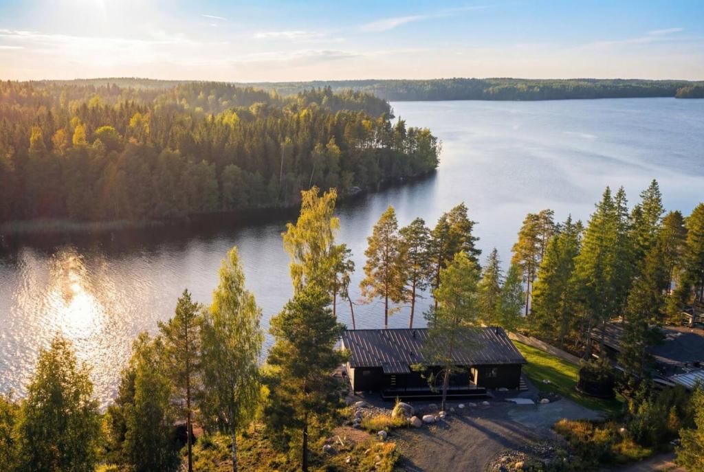 an aerial view of a cabin on a lake at Stay North - Kajastus in Salo
