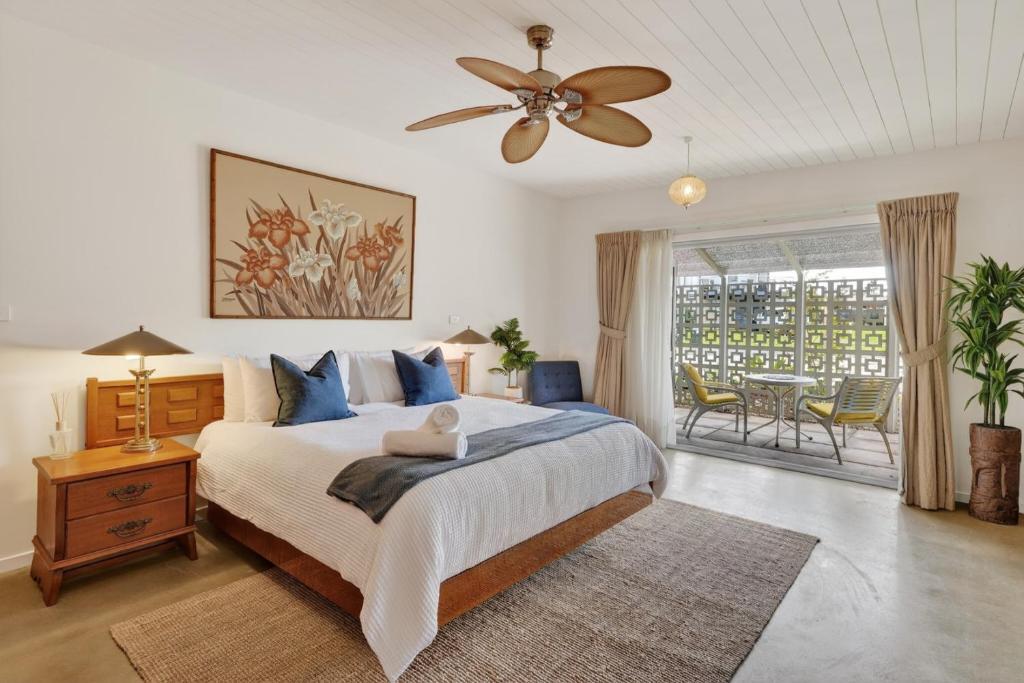 a bedroom with a bed and a ceiling fan at Forty at Yellow Doors in Goolwa South