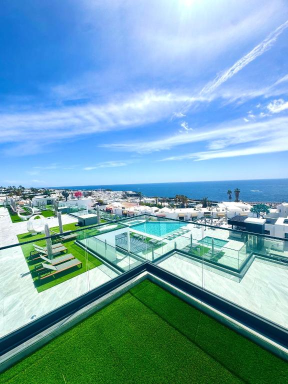 a view of a swimming pool on the roof of a building at Hotel Royal Atlántico in Puerto del Carmen
