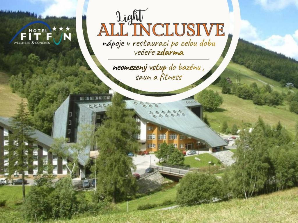 a magazine cover with a large building in a field at Hotel Fit Fun in Harrachov