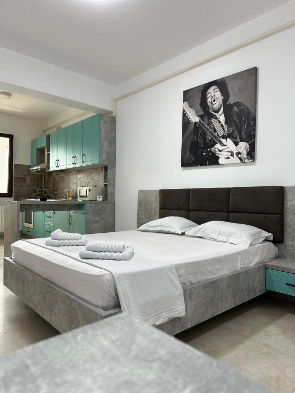 a bedroom with a large bed in a room at Travel Studio in Iaşi