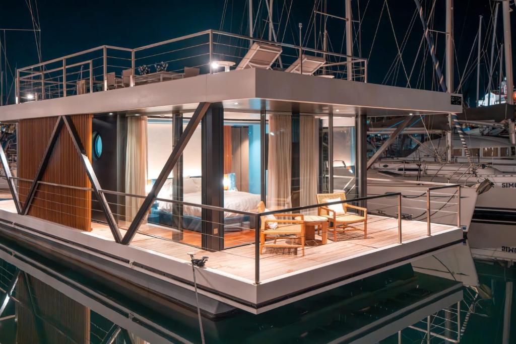 a large boat in the water at night at Marina Suite in Loano
