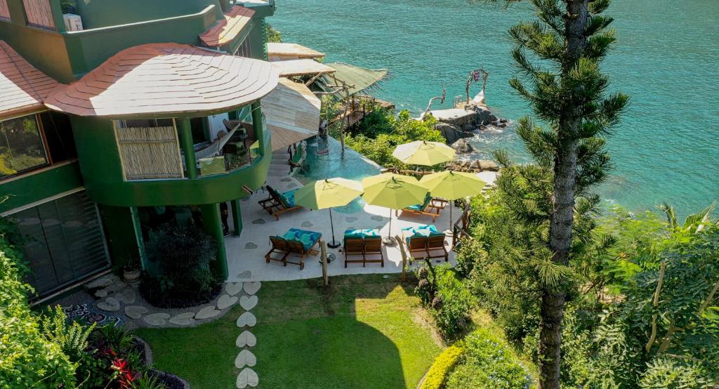 an aerial view of a resort with tables and umbrellas at Villa Lala Boutique Hotel Adults Only in Puerto Vallarta
