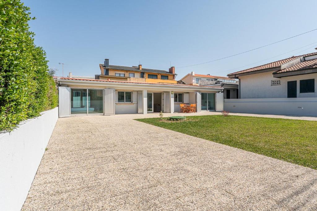 a large house with a driveway in front of it at GuestReady - Charming beachside retreat in Mindelo