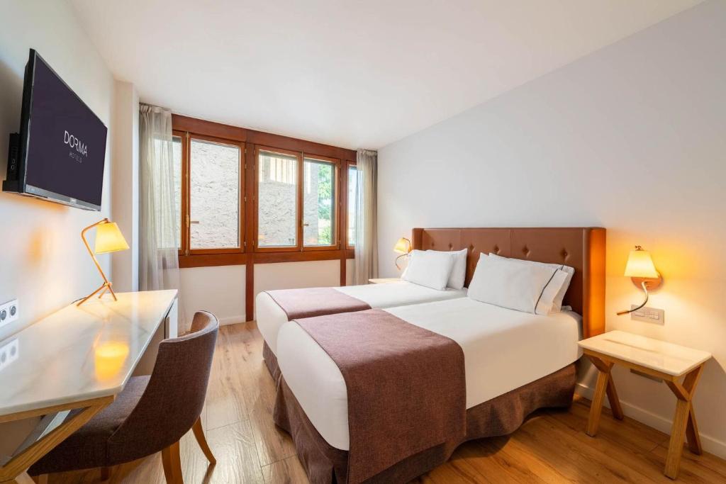 Llit o llits en una habitació de Dorma Casa de Los Linajes